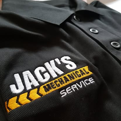 The Jack’s Mechanical Service logo embroidered on a work shirt