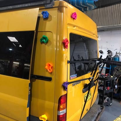 Workshop bay with tools and a vehicle in for repair